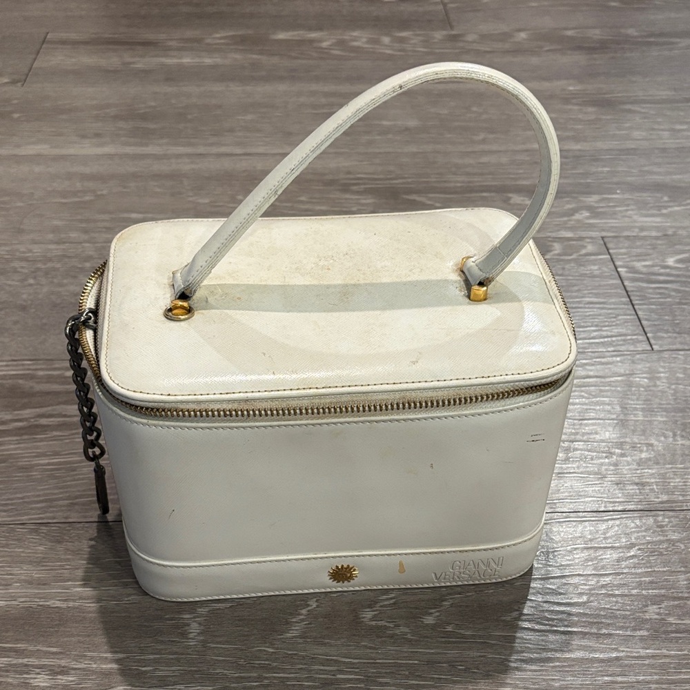 Elegant White Cosmetic Bag with Gold Details